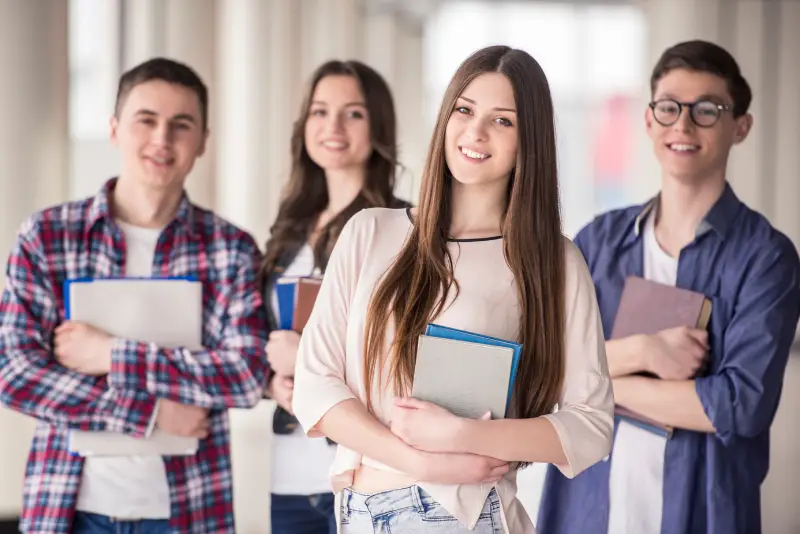 Your Partner in Lifelong Academic Success group of happy teen high school students
